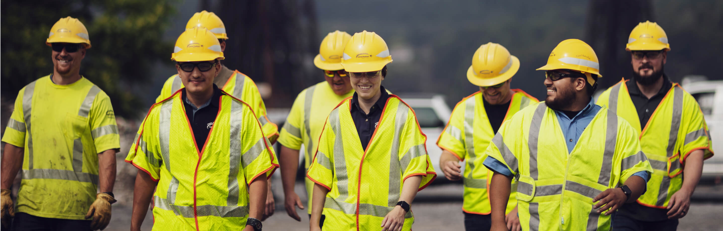 Group of employees walking together in safety gear